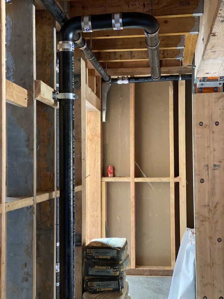 Drain, waste, and vent piping roughed in through open framing