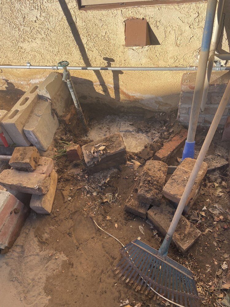 Excavated exterior supply line during a repair